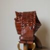 The 100% leather woven wide belt