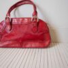 The leather bright red bag