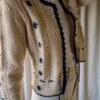 The 100% wool handmade knitted flower cardigan