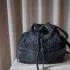 The blue leather bucket bag