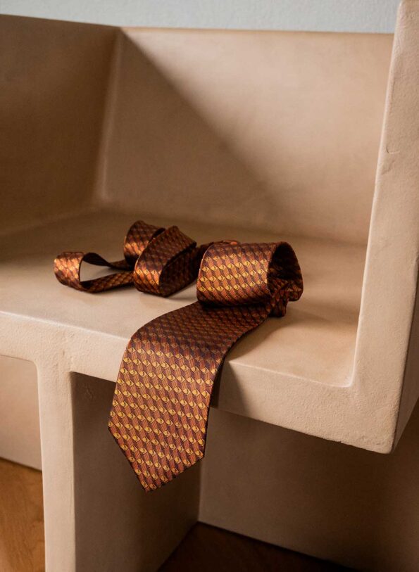 The warm orange silk tie