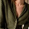 The dark green 100% wool cable cardigan